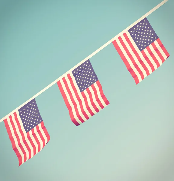 USA flags hanging proudly for July 4 Independence Day — Stockfoto