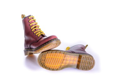 Classic cherry red oxblood Doc Martens lace-up boots clipart