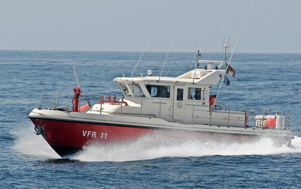 Motor boat of firefighters in action in Genoa