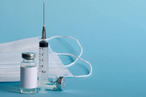Two Vials Medicine Disposable Syringe Protective Medical Masks Close Blue — Stock Photo, Image