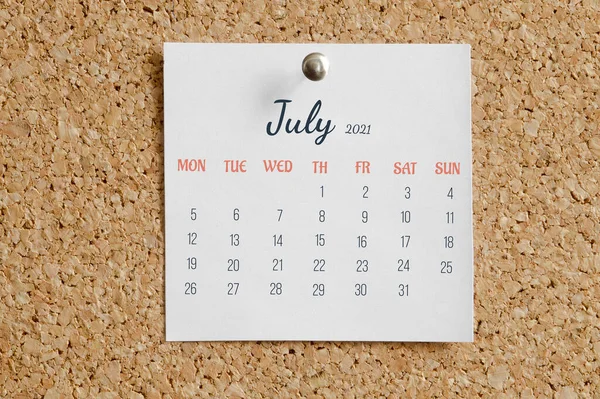 Page from calendar for full month: June 2021. White sheet with dates is pinned to cork board. Concept of calendar date