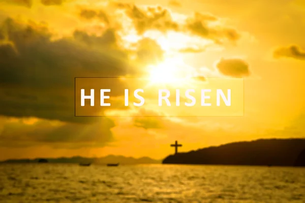 He is risen. text on sunset ,Easter background