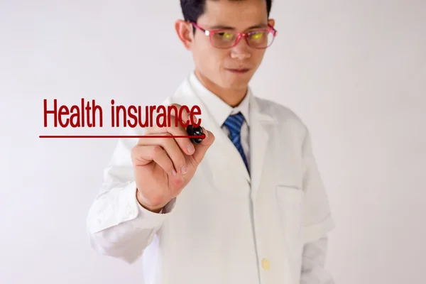 Blurred Doctor writing Health insurance — Stock Photo, Image