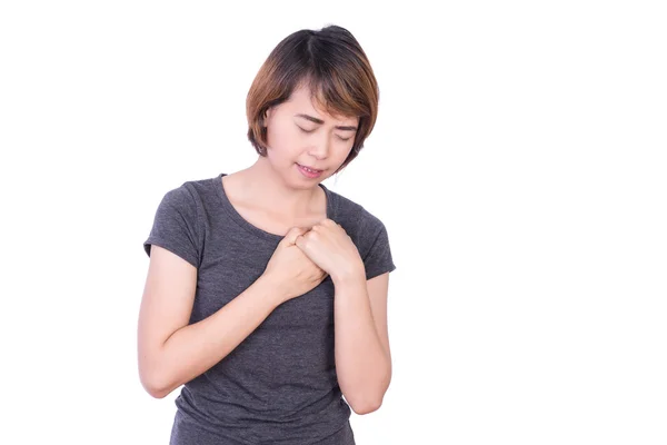 Молодая азиатская женская душевная боль, давящая на грудь с болезненным выражением лица у подростков — стоковое фото