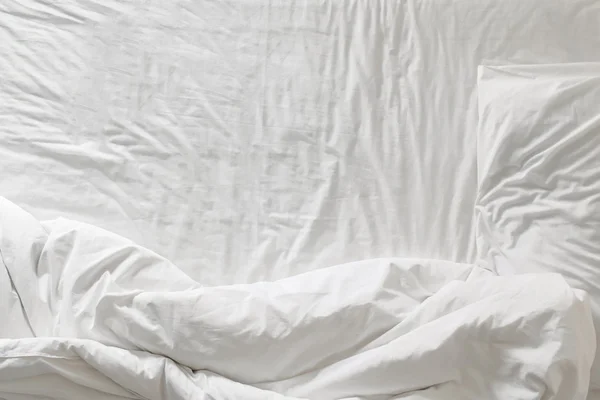 Top view of white bedding and pillow at morning time comfortable sleep