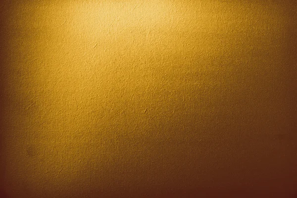 Fondo de degradado dorado oscuro con foco — Foto de Stock