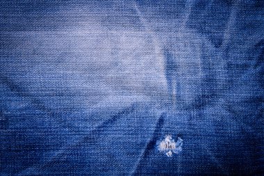 Denim kot pantolon yırtık eski ile arka plan doku