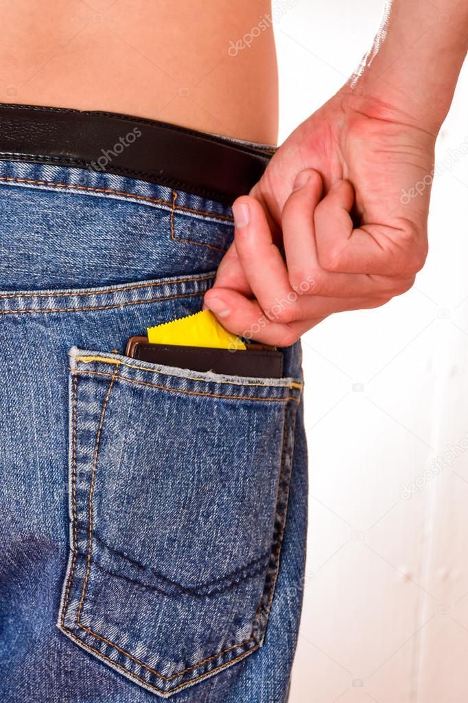 Condoms and  billfold,in jeans pocket.