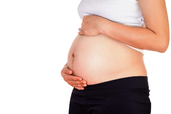 Detailní záběr roztomilé těhotné břicho, izolované na whitebackground — Stock fotografie