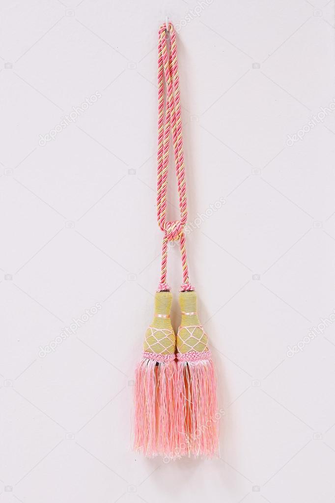golden pink luxury tassels for beautiful curtain on white home wall