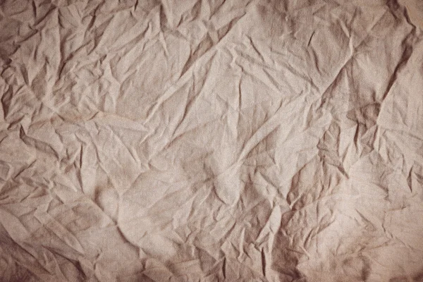 Zmarszczki, zmarszczki, brązowy tekstura tkanina tło. — Zdjęcie stockowe