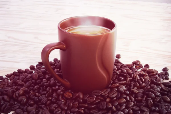 Coffee cup on table (lomo filter effect) — Stock Photo, Image