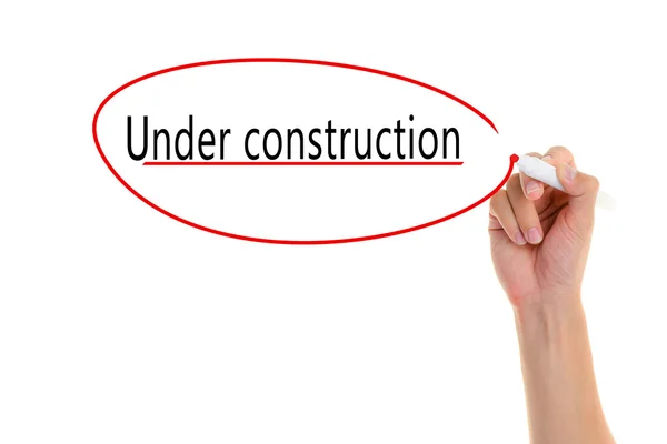 Hand  writing Under construction on visual screen. — Stock Photo, Image