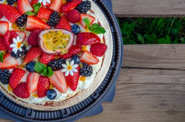 Anna Pavlova French dessert with blackberries,blueberries, passion fruit, raspberries, strawberries. Meringue, Vegetarian, Low fat, Dietary cake. clipart