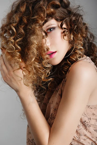 Beautiful girl with curly hair — Stock Photo, Image