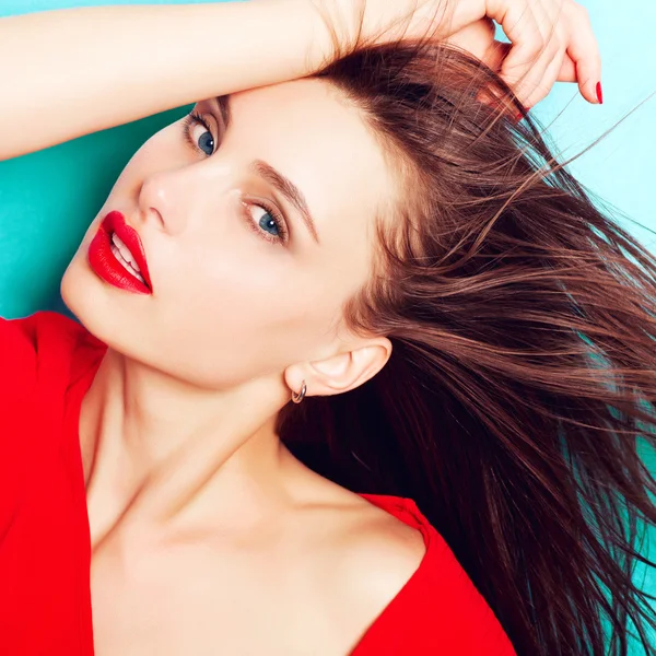 Brunette woman in a red dress — Stock Photo, Image