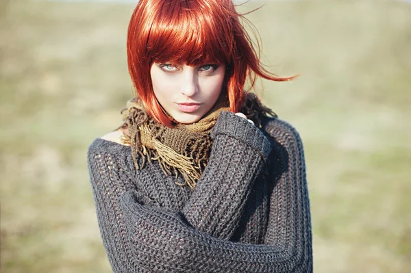 Girl with red hair  wearing a warm pullover — Stock Photo, Image