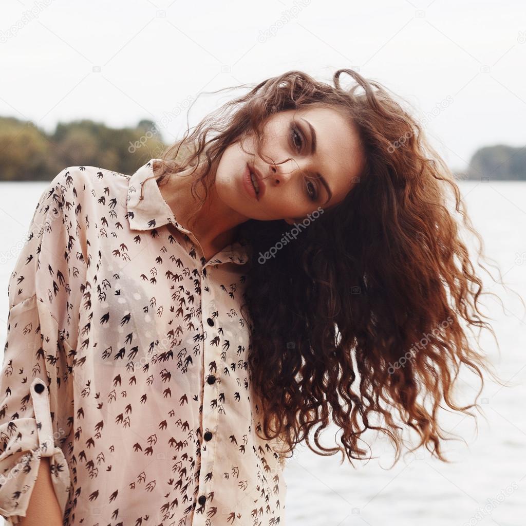 sensual woman with curly hair