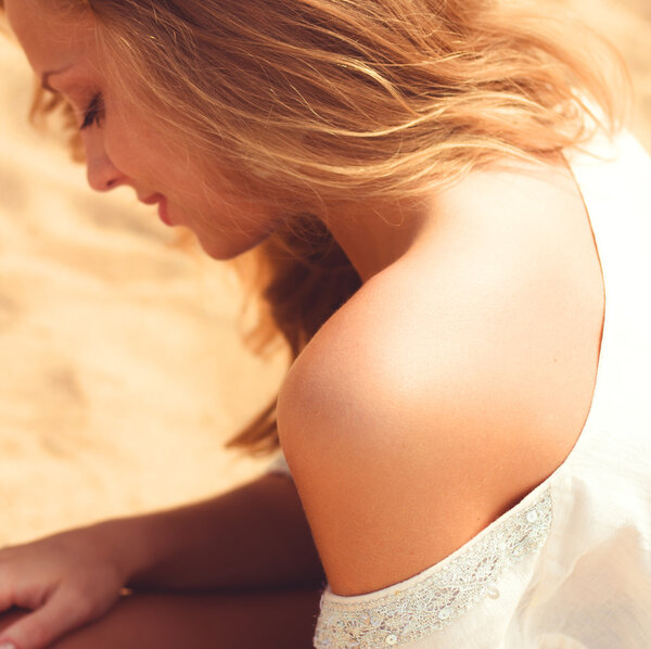 woman sunbathing on the beach