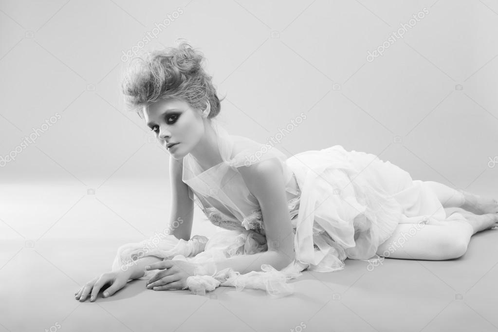 woman with make up in white long dress