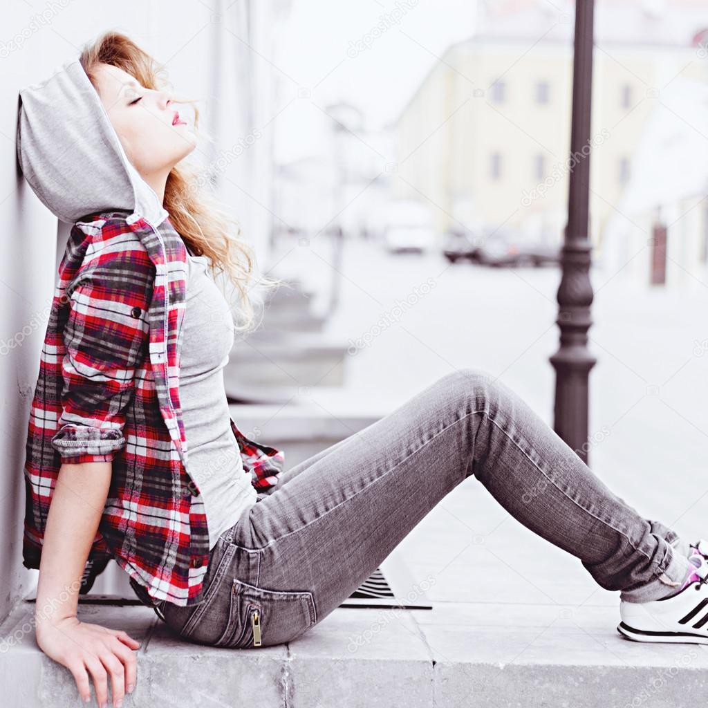 beautiful woman  sitting on the ground