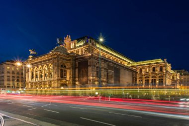 Night view of the Vienna State Opera in Austria, captured on November 1, 2025, with illuminated architecture and dynamic light trails from passing traffic.