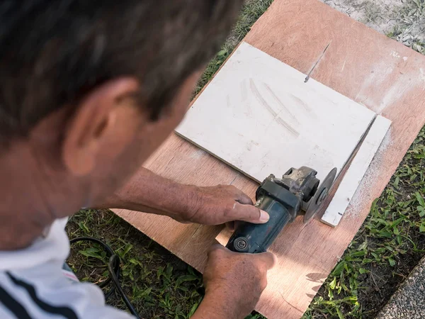 Man Cuts White Tile Old Compact Circular Saw Sheet Plywood — Stock Photo, Image