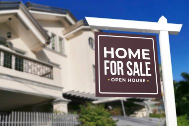 A Home for sale and open house sign in front of a large gated house. clipart