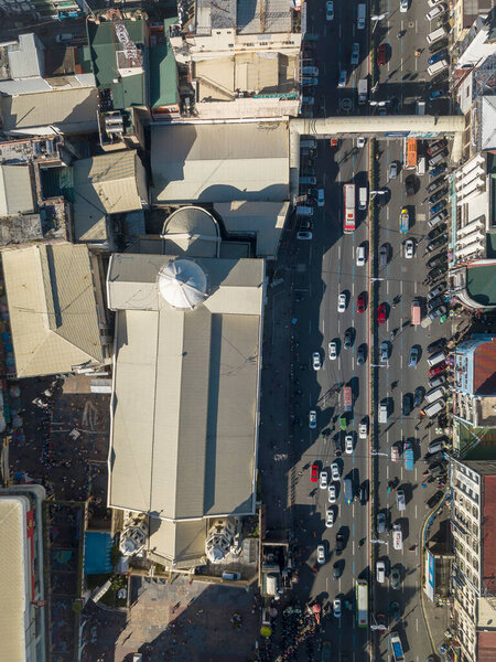 Quiapo, Metro manila, Philippines - Top view of the district of Quiapo. A busy weekend at the city. The famous church at the left.