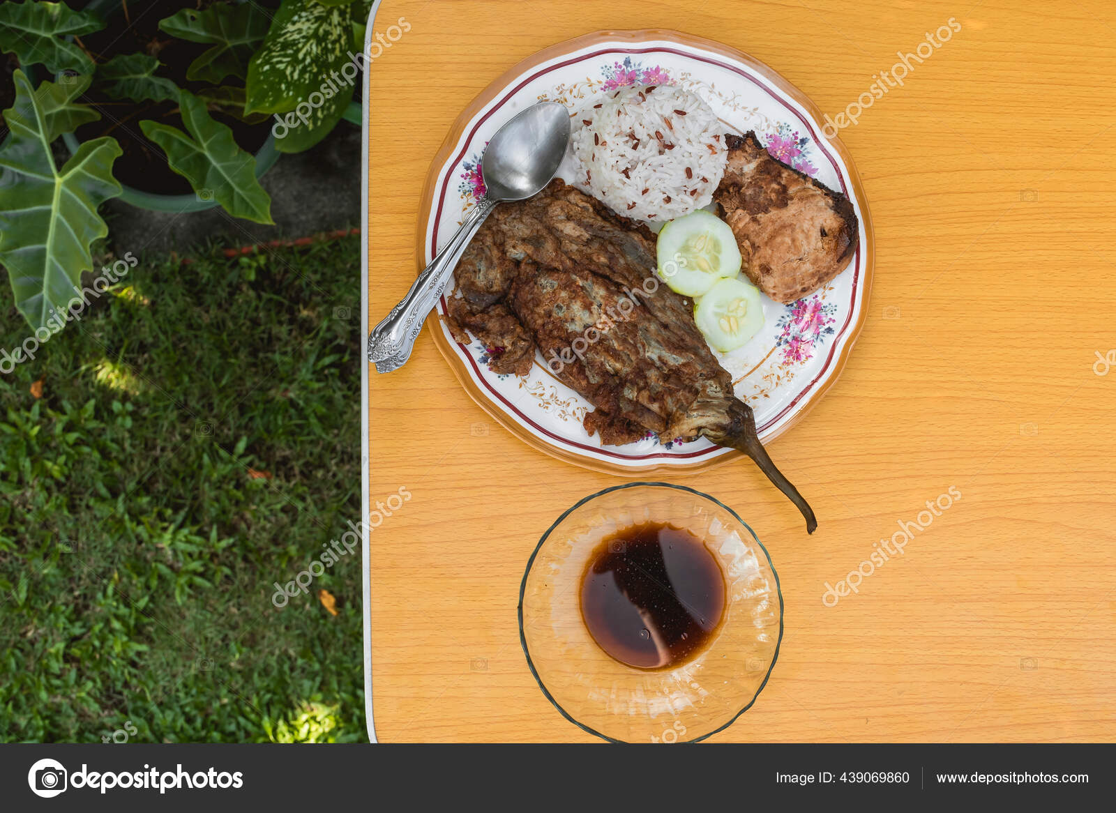 Sumptuous Filipino Style Lunch Garden Tortang Talong Fish Steak Cup Stock Photo by ©MikeEdwards