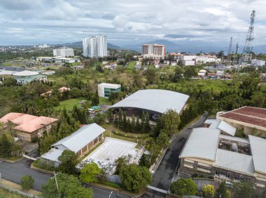 Tagaytay, Cavite, Philippines - Jan 2021: The cityscape of Tagaytay, with vacant lots, houses and highrise condmoniums dotting the landscape.