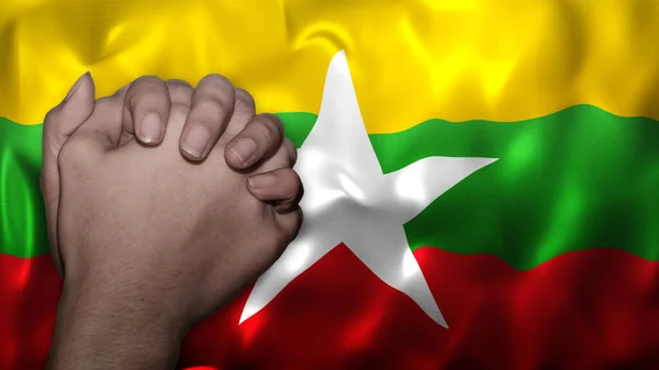A hand praying with Flag of Myanmar as background. Grunge look. Can represent adversity, crisis, Christian or Catholic prayer, forgiveness, worship or plea in country. 3d illustration
