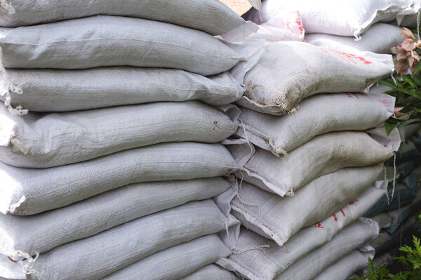 Sacks of organic fertilizer for sale at a plant store or stored at a warehouse.