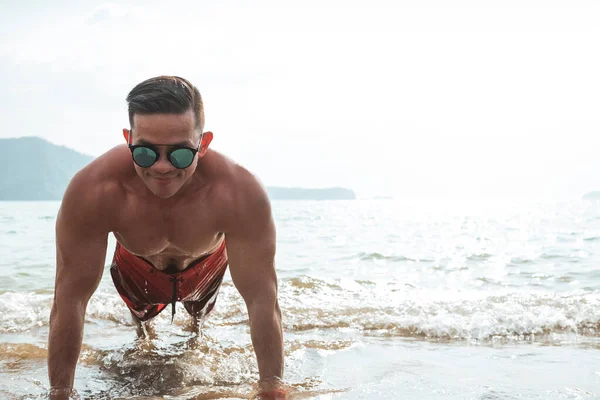 Fit Athletic Asian Man Does Pushups Beach Working Out Training — Stock Photo, Image