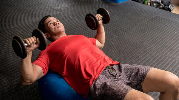 Fit Handsome Asian Guy Does Stability Ball Dumbbell Chest Press — Stock Photo, Image