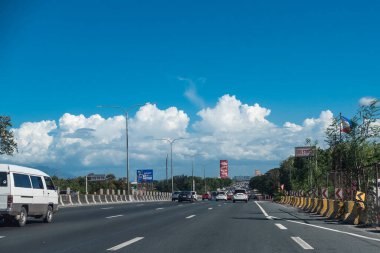 San Pedro, Laguna, Philippines - Driving along SLEX (South Luzon Expressway), a major highway in the country. clipart