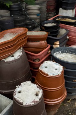 Various painted Terracotta clay pots for sale at a garden supplies store in Tagaytay, Cavite, Philippines.