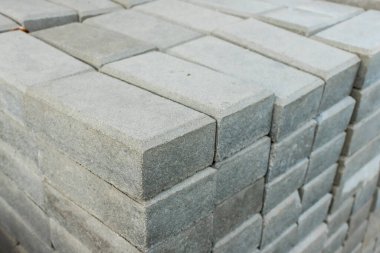 Rectangular brick shaped concrete pavers for sale. On display outside a garden supply store or hardware shop.