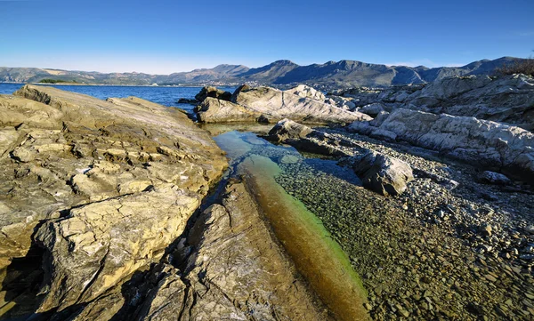 Rocky shore of the Adriatic Sea in sunny morning — Stock Photo, Image