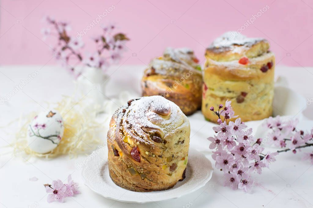 Baking craffin on a white table against a backdrop of cherry blossoms. Side view