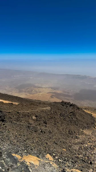 Desert, yellow rocks against the blue sky. Scenic ascent to Mount Teide, Tenerife