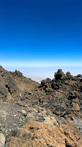 Desert, yellow rocks against the blue sky. Scenic ascent to Mount Teide, Tenerife