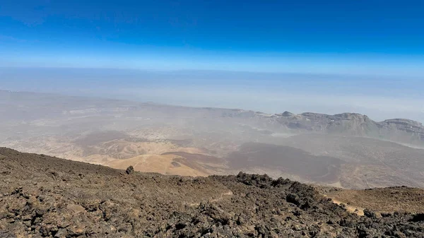 Desert, yellow rocks against the blue sky. Scenic ascent to Mount Teide, Tenerife