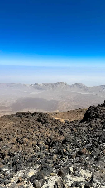 Desert, yellow rocks against the blue sky. Scenic ascent to Mount Teide, Tenerife