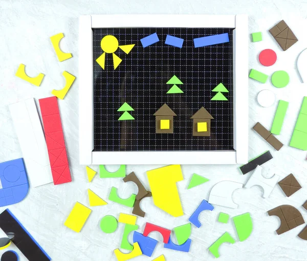   Details of colorful children's constructor, colorful mosaic, educational game for preschoolers. Colorful toys, copy space, homeschooling. concept of creativity, handwork, preparation for the holiday        