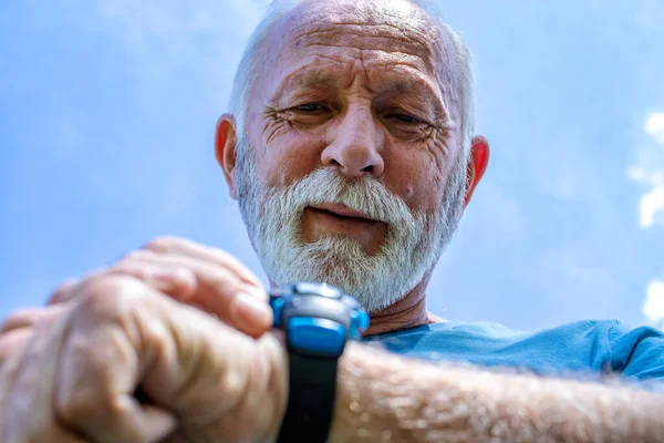 Portrait Senior Man Checking His Watch Elderly Sportsman Controlling His — Stock Photo, Image