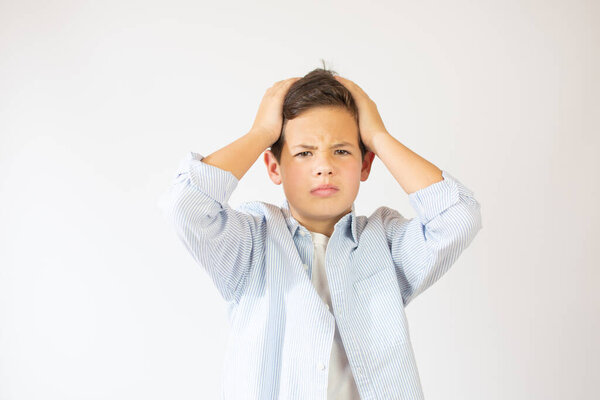 Portrait of unhappy teen boy, stressed with hand on head. Cute young caucasian teenager fears and upset for mistake. Sad child close eyes shocked, isolated on white background.