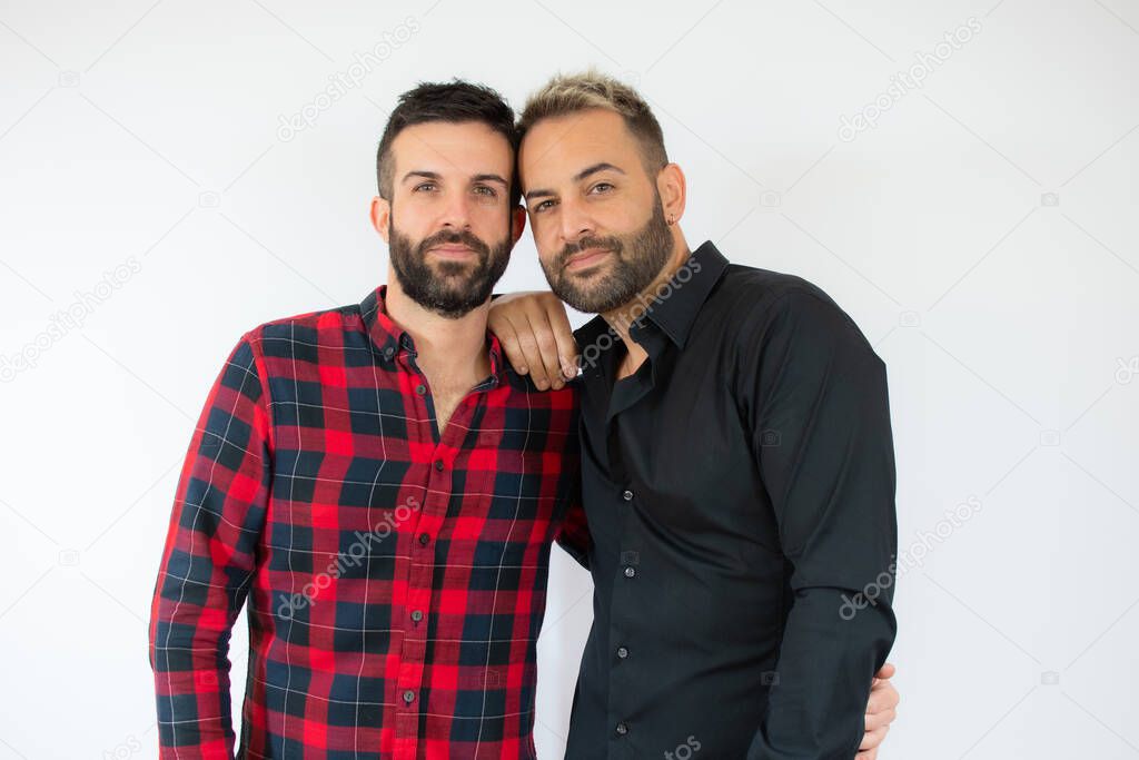 A young gay couple over white background.
