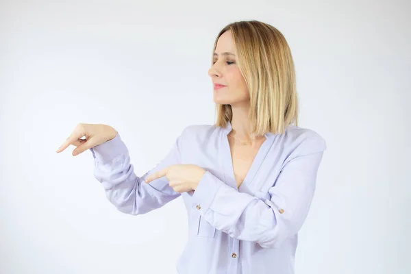 Smiling Woman Wearing Casual Shirt Pointing Fingers Side Isolated Portrait — Stock Photo, Image