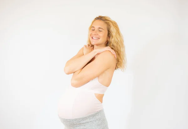 Young Beautiful Woman Pregnant Expecting Baby Hugging Oneself Happy Positive — Stock Photo, Image